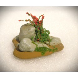 Décor de pierres et plantes fleuries